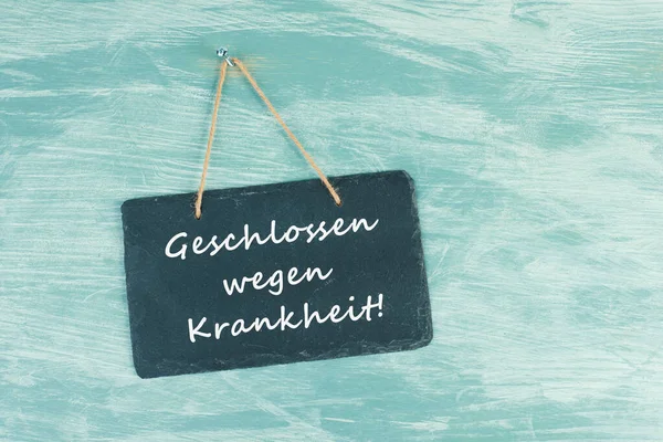 Words Closed Because Illness Standing German Language Chalkboard Sign Hanging — Stockfoto