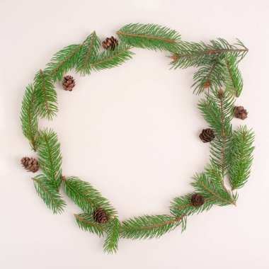 Christmas holiday background, frame with fir branches and cones, winter season greeting card with copy space 