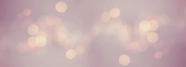 Bokeh background for christmas, defocused round lights in pastel color, flare overlay