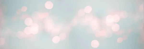 Bokeh background for christmas, defocused round lights in pastel color, flare overlay