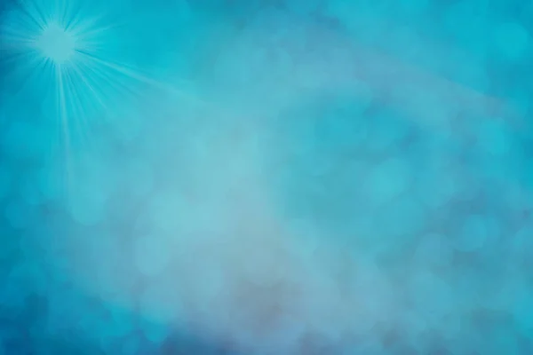 Noel Için Mavi Bokeh Arkaplan Çözülmüş Yuvarlak Işıklar Güneş Işınları — Stok fotoğraf
