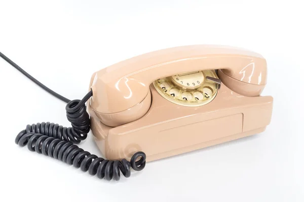 白い背景に古い学校のピンクの電話 電気通信だ ヴィンテージオブジェクト — ストック写真