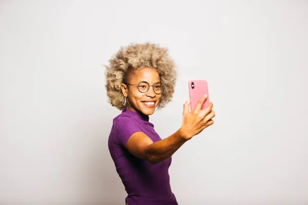 Portrait Smiling Young Woman Using Smart Phone While Standing White — Stok Foto