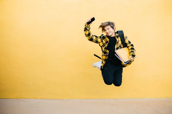 Teenager Smiling Student Boy Notebooks Black Backpack Jumping Front Yellow — Fotografia de Stock