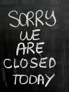 Message on blackboard in front of the shop.