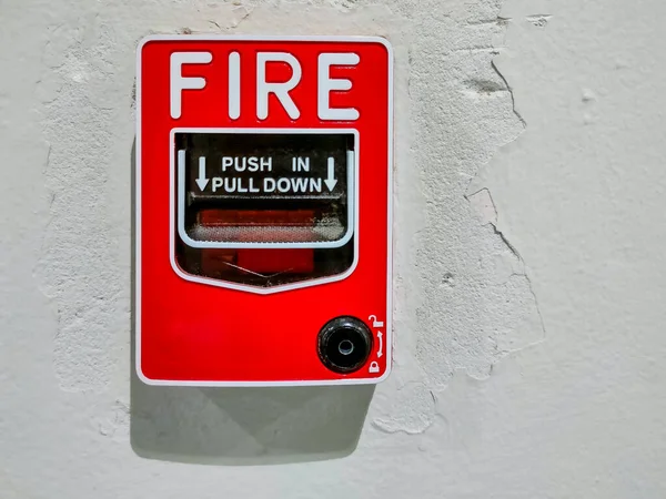 Indoor fire alarm box mounted on the wall.
