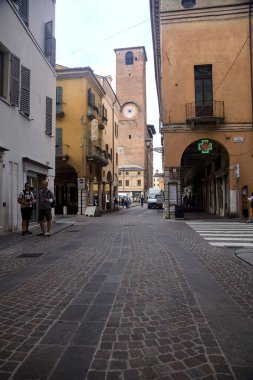 Crossroads with people passing by