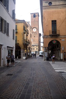 Crossroads with people passing by