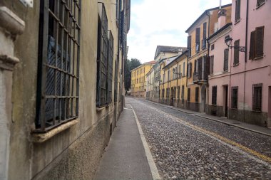 Downward cobbled street on a cloudy day