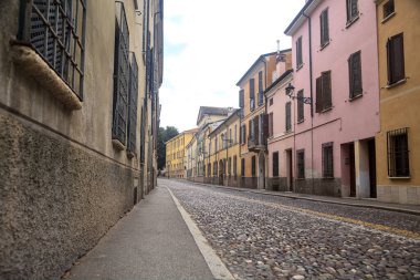Downward cobbled street on a cloudy day