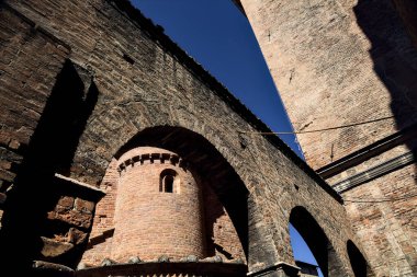 Part of brick buildings one next to another on a sunny day