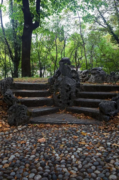 Stone staircase by the edge of a slope in a park