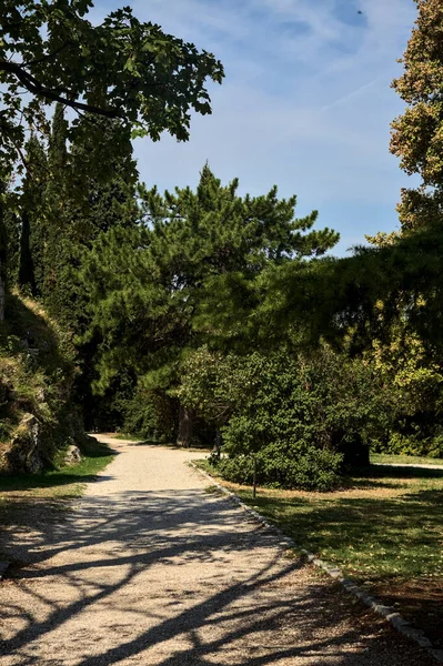 Gravel path in a garden of a castle on a sunny day