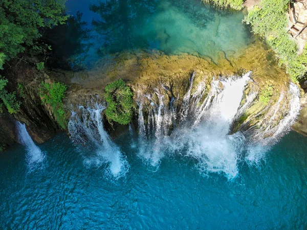 aerial view of a waterfall produced by the elsa river in tuscany