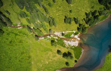 vertical aerial view of a small lake in the dolomites trentino italy