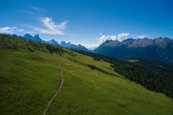 aerial view of a path that runs through the Trentino Dolomites