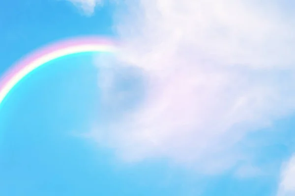 soft focus cloud and rainbow on blue sky