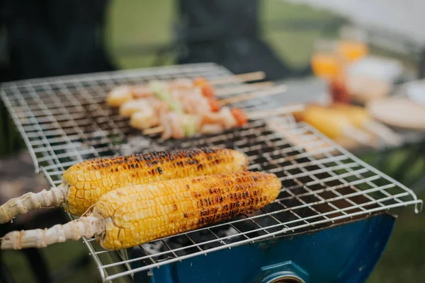 Grilled corn with butter and salt on the grill plate. roasted sweet corns on the grill.