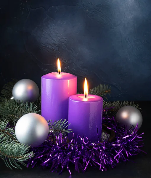 Lilac Candles Burn Dark Blue Background Purple Garlands Silver Balls Stock Image
