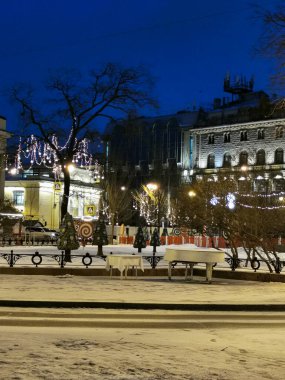 Saint Petersburg. Russia. Showcase of the House of Books decorated with fairy-tale characters from Soviet postcards and wreaths for Christmas and New Year.