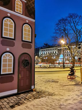 Saint Petersburg. Russia. Showcase of the House of Books decorated with fairy-tale characters from Soviet postcards and wreaths for Christmas and New Year.