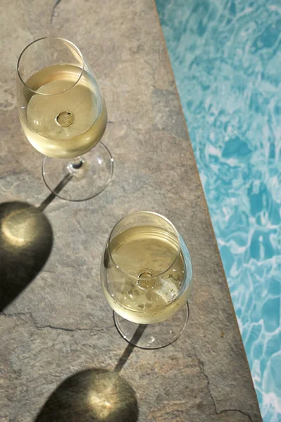 Closeup Summer White Wine Glass near pool