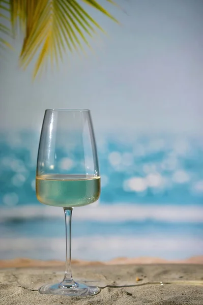 Closeup Summer White Wine Glass on Sand Beach