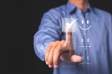 The man's finger pressed for the highest satisfaction score on the virtual screen ,Customer satisfaction rating