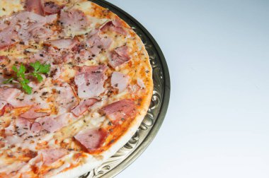 Photo of a delicious bacon pizza with cheese
