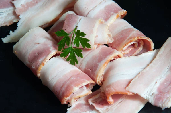 Delicious bacon on top of a dark background