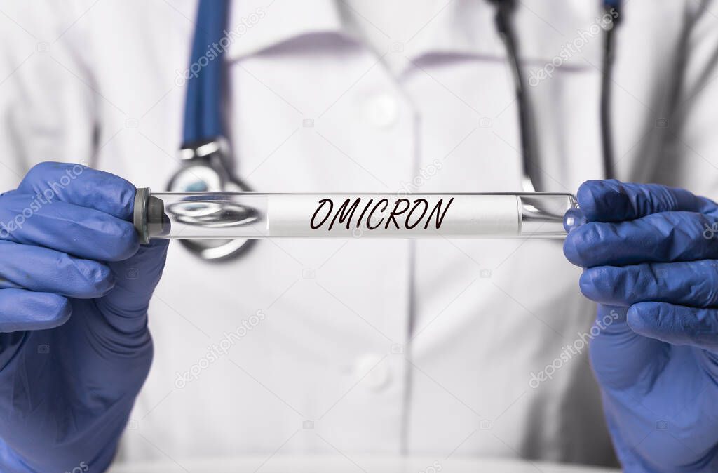 Omicron variant of corona virus. Word on glass tube