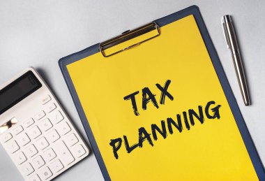 Hesap makinesiyle kağıt üzerinde vergi planlama metni