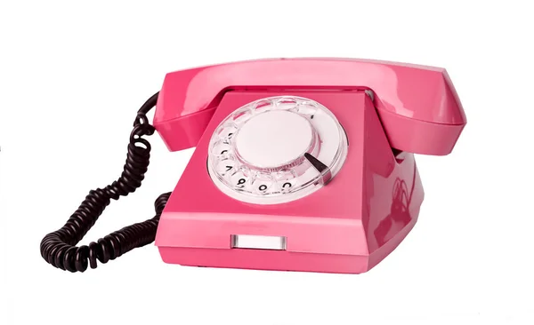Roze retro telefoon geïsoleerd op witte achtergrond. Telefoon met draaiknop — Stockfoto