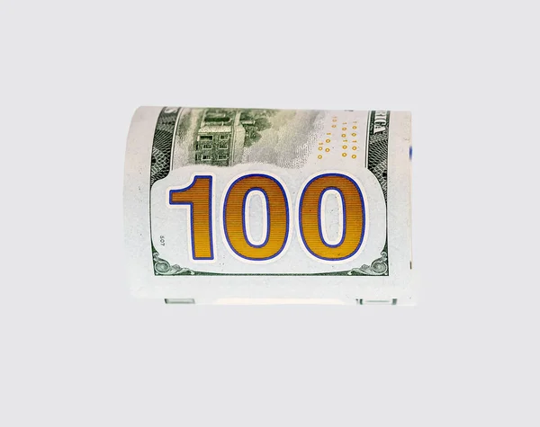 Enrolló un billete de cien dólares. Concepto de moneda y dinero estadounidense —  Fotos de Stock