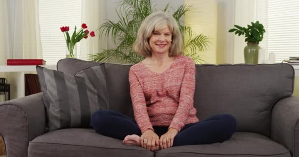 Attractive Senior Woman Smiling Couch — Stock Video