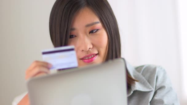 Chinese Woman Typing Credit Card Information — Stock Video