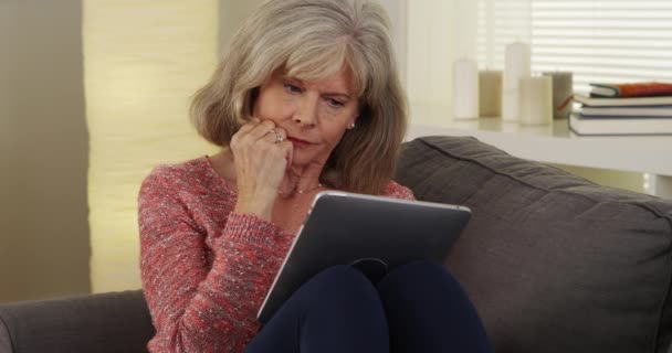 Beautiful Mature Woman Tablet Reading — Stock Video