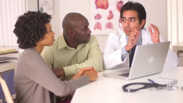 Hispanic Doctor Talking African American Couple Laptop Computer — Stock Video
