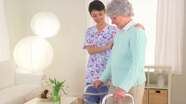 Chinese Nurse Helping Elderly Patient Walk — Stock Video