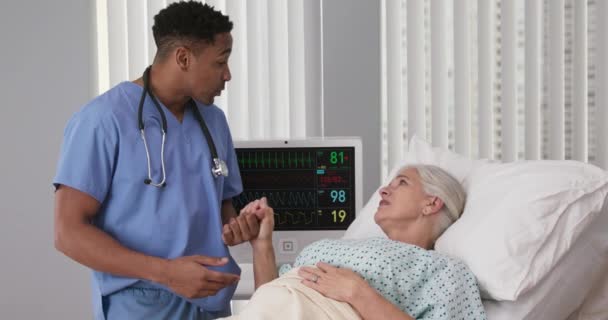 Portrait Young Male Nurse Showing Support Elderly Senior Patient Bed — Stock Video