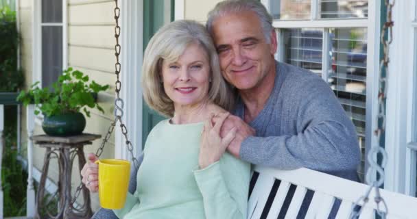 Elderly Couple Smiling Porch Looking Camera — Stock Video