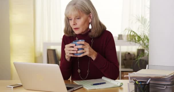 Mature Woman Drinking Coffee Using Laptop Computer — Stock Video