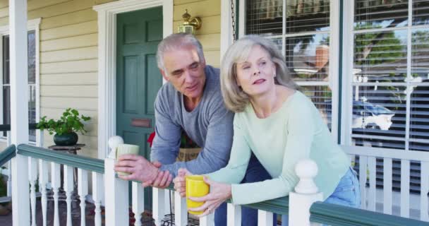 Happy Senior Couple Sitting Porch Talking — Stock Video