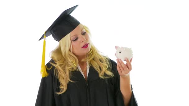 Young Woman Graduation Gown Holding Hammer Piggy Bank — Stock Video