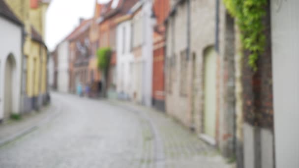 Out Focus Background Plate Narrow Curving Cobblestone Street Bruges Lined — Stock Video
