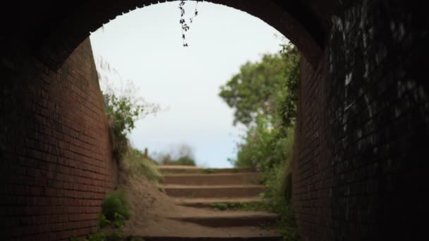 Brick Passage Leading Sandy Steps Hiking Trail Defocused View Tunnel — Stock Video