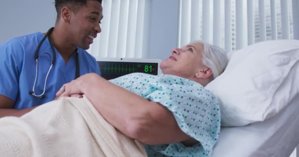 Portrait Young Male Doctor Showing Support Elderly Senior Patient Bed — Stock Video