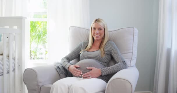 Beautiful Pregnant Woman Sitting Nursery Smiling — Stock Video