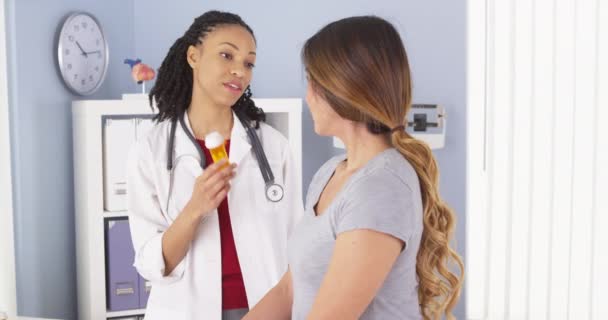 Black Doctor Explaining New Prescription Japanese Patient — Stock Video