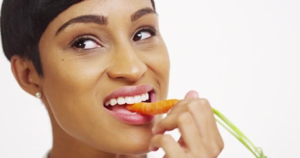 Close Black Woman Eating Carrot White Background — Stock Video